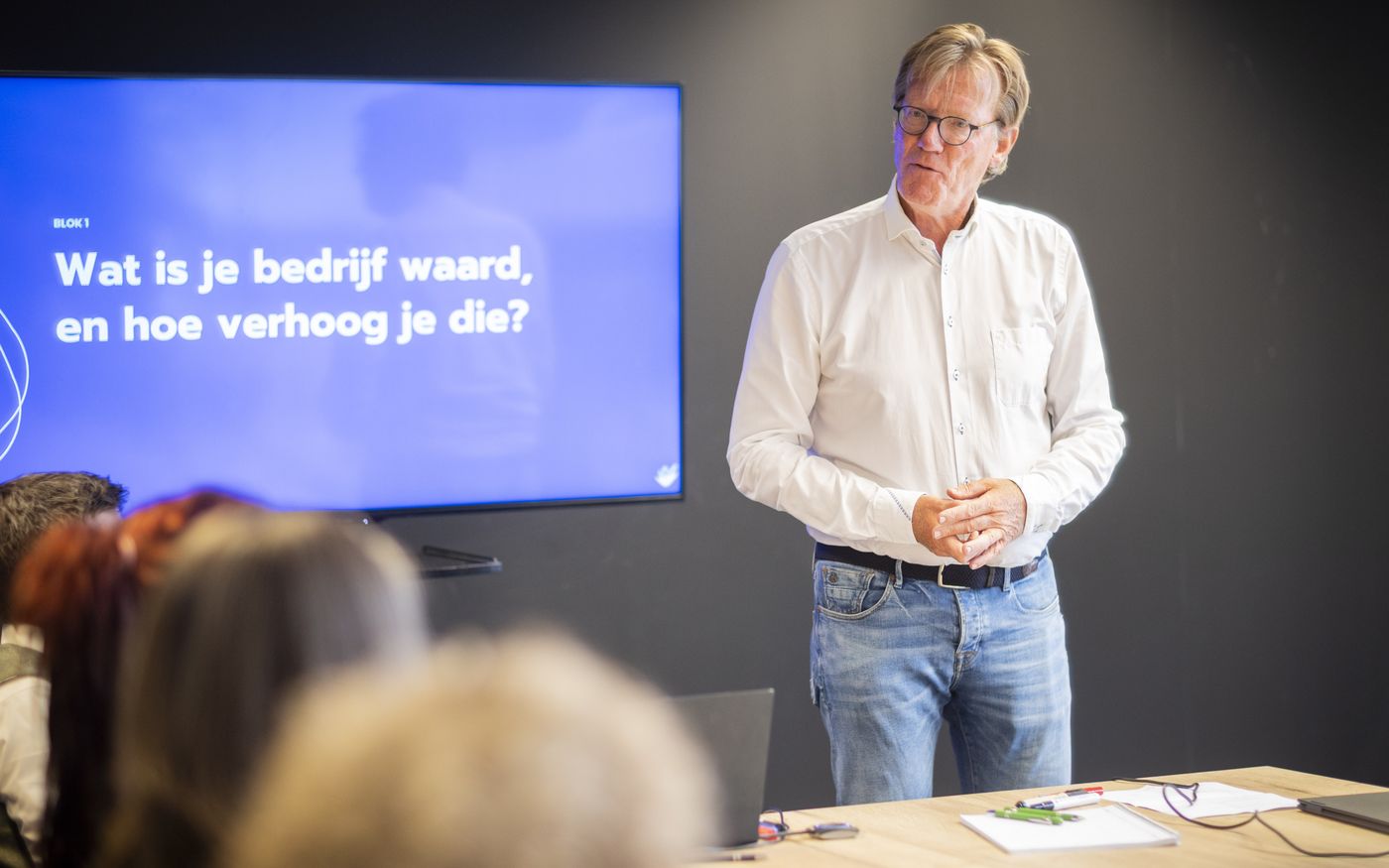 Spreker legt tijdens een sessie de meest gebruikte waarderingsmethoden uit